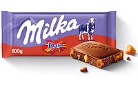 Молочний шоколад Milka Daim зі шматочками хрумкої карамелі з мигдалем 100 г, Німеччина