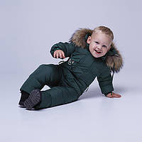 Детский однотонный зимний комбинезон темно-зеленого цвета и опушкой из натурального меха 92 см.