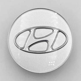Ковпачки (заглушки) на литі диски HYUNDAI (Хундай) 57 мм Сріблясті скло (52960-1E400)