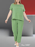 Костюм жіночий брючний вільного крою у зеленому кольорі льон жатка розміри 52  58