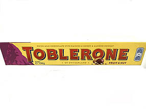 Шоколад TOBLERONE з медово-міндальною нугою та родзинками 100 г