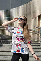 Оверсайз футболка для дівчинки з матеріалу кулір з журнальним принтом р. 104-170