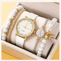 Комплект жіночий кварцевий наручний годинник та браслети.