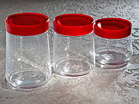 Набір банок для сипких продуктів «Jar SWING» (0,5 л, 0,75 л, 1 л) з червоними кришками.