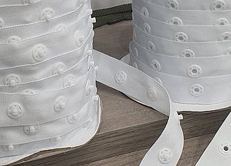 Кнопки пластикові на тканинній стрічці (боді) колір білий (нейлон)