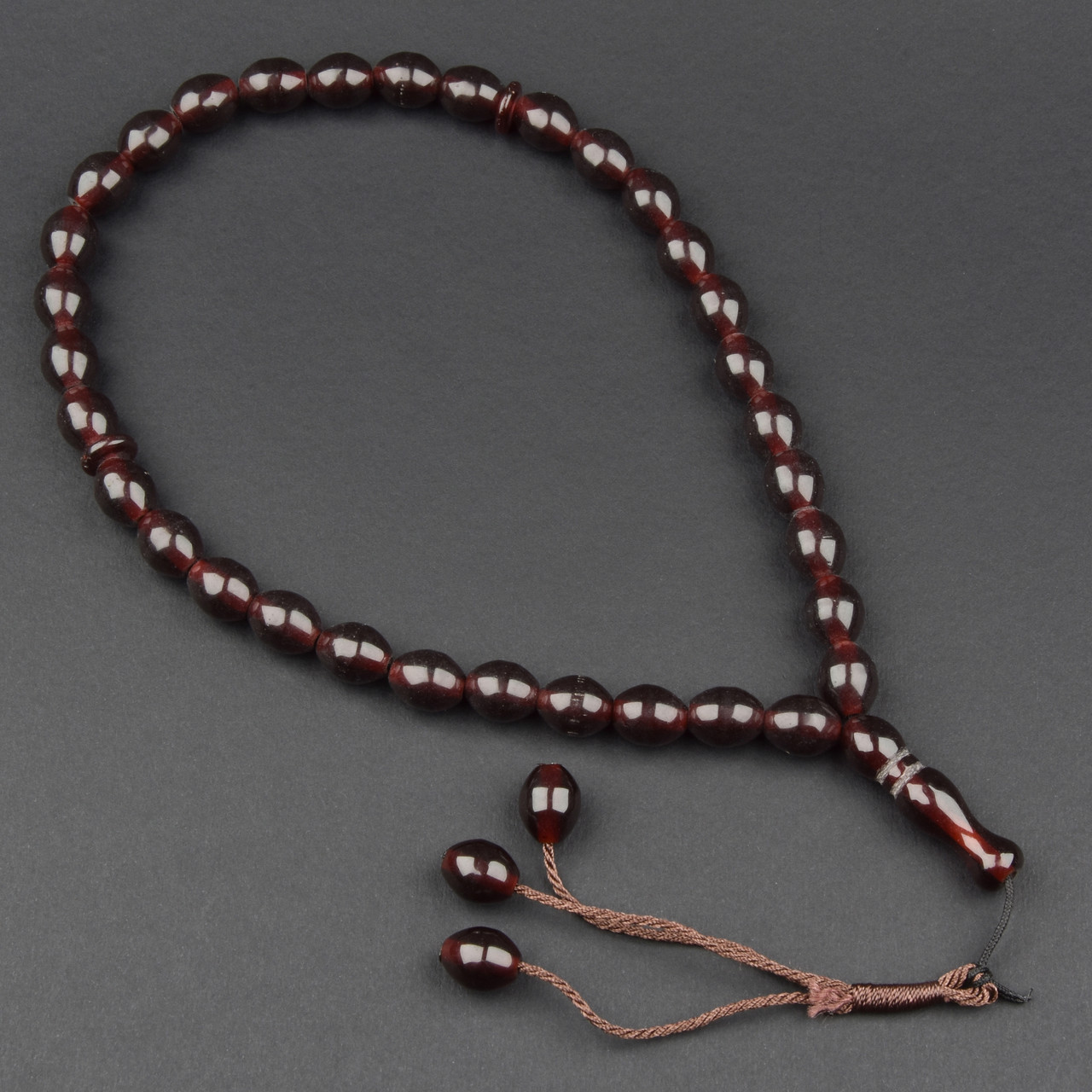 Чітки пластикові з коричневими овальними намистинами та висувною кількістю намистин 33 штуки довжина 70 см - фото 1 - id-p1940217417