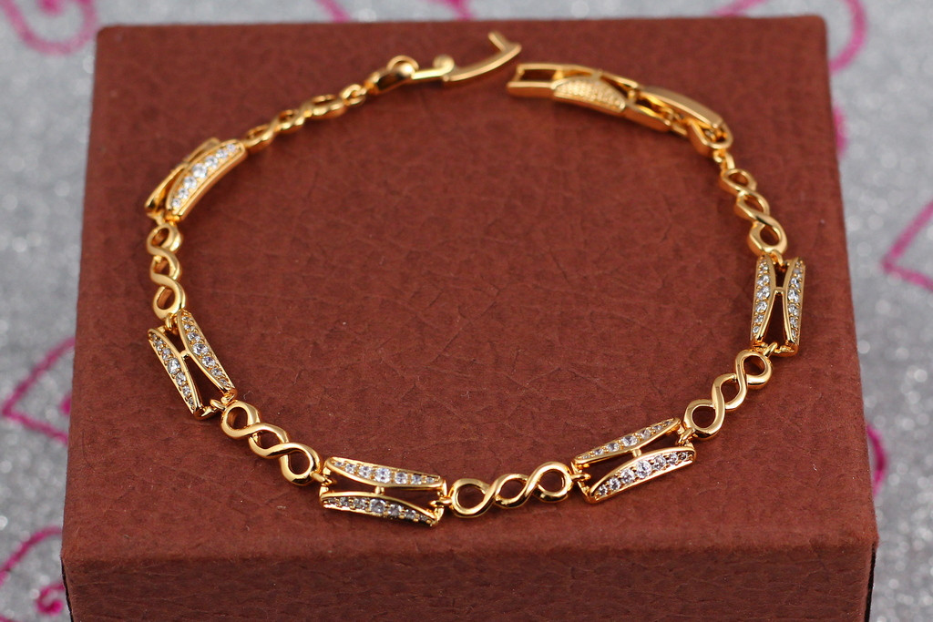 Браслет Xuping Jewelry прямокутні ланки з потрійними кільцями з білими каменями 17 см 5 мм золотистий