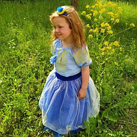 Детская вышитая блуза Ольга на голубом льне с желтой вышивкой