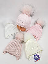 Дитячі польські зимові в'язані шапки на флісі з зав'язками і помпоном оптом для дівчат, р.38-40, Grans