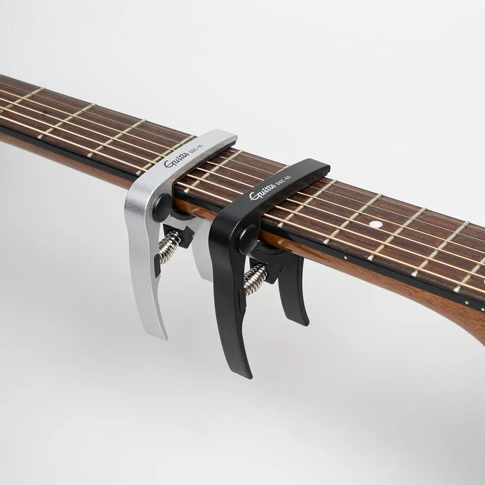 Каподастр Joyo Guitto GGC-06 серебристый для акустической гитары, электрогитары, укулеле - фото 2 - id-p1949646075