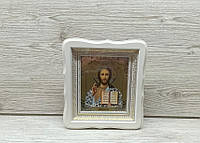 Икона Спаситель в белом деревянном киоте под стеклом