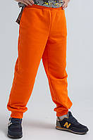 Джоггеры для мальчика оранжевого цвета из материала трехнитка качества пенье р. 104-170
