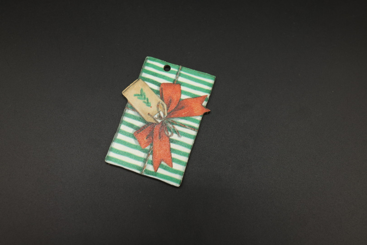 Дерев'яна новорічна іграшка з друком. 70х50мм