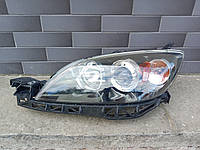 Фара Mazda 3, Мазда 3. Xenon. Хетчбек, левая. 2003 - 2008.