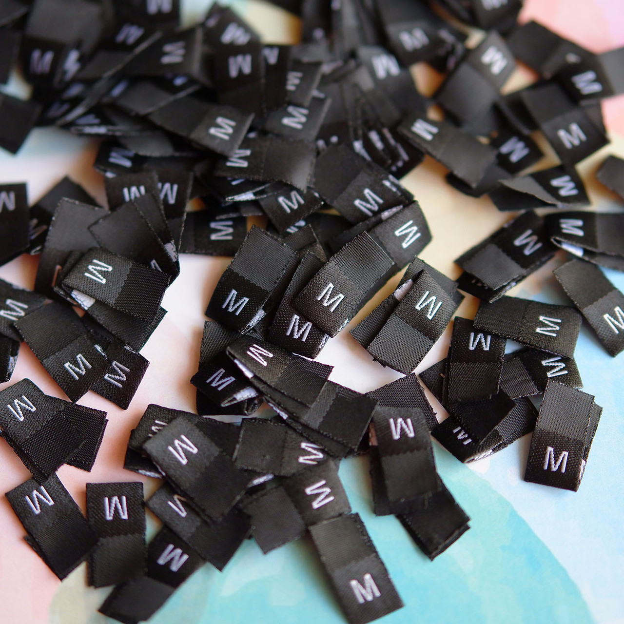 Розмірники жакардові чорні, 1000шт M