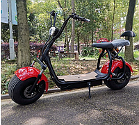 Самокат-скутер електричний позашляховий із широкими колесами та сидінням
