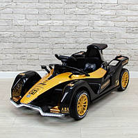 Дитячий гоночний електромобіль McLaren Formula 1 (чорний/золотистий колір) 12V