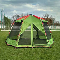 Шатер -палатка,зеленого цвета ,с крепким стальным каркасом,для туристических походов ,в летнее время года .
