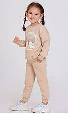 Бежевий теплий спортивний костюм на дівчинку світшот і штани на манжеті в розмірі 92
