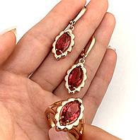 Комплект с рубиновыми кристаллами покрытие золотом 18к. серьги и кольцо размер 18.19.20.