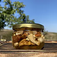 Мед акації з горіхами асорті 0,1 л (140 грам)