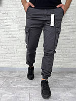 Джинсы джогеры мужские карго с накладными карманами антрацит | Серые коттоновые штаны джогеры с манжетами