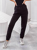 Женские зимние штаны удобного кроя на манжетах черные размеры 42-56