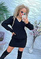 Женский стильный вязаный костюм свитер свободного кроя и мини юбка