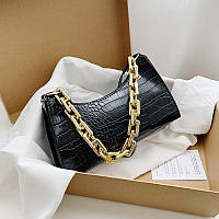 Женская сумочка багет в стиле рептилии с цепочкой черная