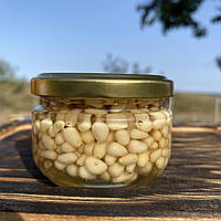 Кедрові горішки у акацієвому меду 0,1 л (140 грам)