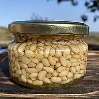 Кедрові горішки у акацієвому меду 0,25 л ( 270 грам)