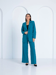 Жіночий класичний брючний костюм у бірюзовому кольорі. Розміри 46.