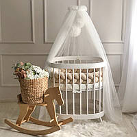 Балдахін із помпонами молочний