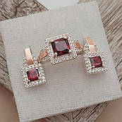 Комплект зі срібла з золотими напайками квадратним червоним і білими круглими фіанітами
