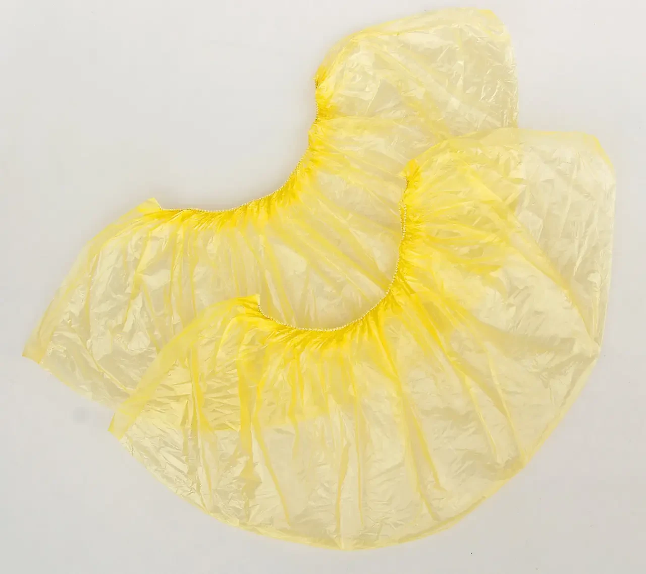 Бахіли одноразові поліетилен (4 гр пара) 200 пар в упаковці (жовті)