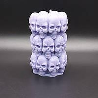 Свічка у формі черепа фіолетового кольору