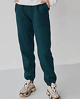 Зеленые женские спортивные штаны джоггеры с завышенной посадкой и карманами по бокам