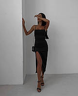 Стильное черное вечернее платье длиной миди с глубоким разрезом по бедру и открытой спиной