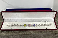 Жіночий браслет "Ніжні пелюстки з яскравими цирконами в білому золоті" - подарунок дівчині у оксамитовому футлярі