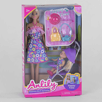 Лялька в комплекті з аксесуарами, дитиною та коляскою упакована у коробку