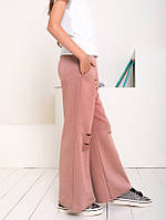 Бежевые свободные рваные брюки из трикотажа размер 140