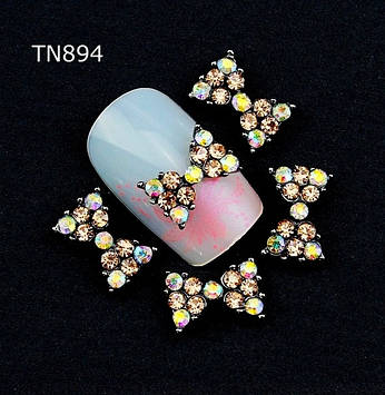 Декоративний елемент. Розмір 7х10мм.Цина за 1 шт.