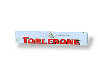 Білий шоколад TOBLERONE з медом та мигдальною нугою, 100 г