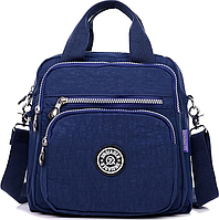 Сумка рюкзак жіночий має одне основне відділення та чотири зовнішні кишені на блискавці синій