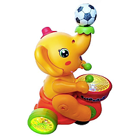 Детский музыкальный слоник-жонглер 664B с барабаном и левитационным мячиком, оранжевый