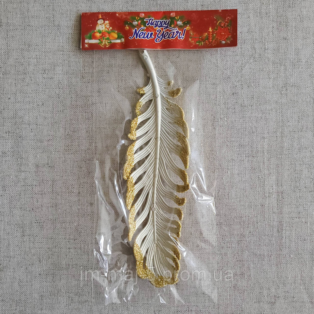 Іграшка на ялинку "Пір'їна" золотиста