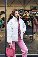 Тепла зимова демісезонна жіноча куртка молочна