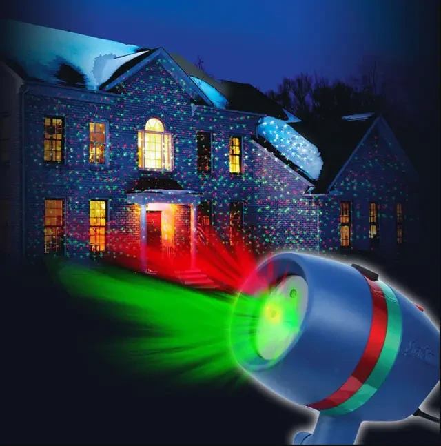 Лазерна установка проектор Новорічне освітлення вологостійке покриває 100 м², світить червоним і зеленим.