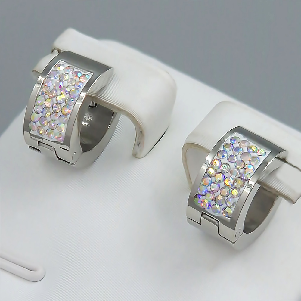 Сережки Stainless Steel. Сталь. Родій. Камені: бензиновий циркон. Діаметр: 12 мм. Ширина: 5 мм.