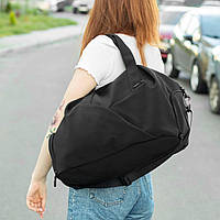 Женская дорожная спортивная сумка с отделение под обувь Vast на 34 литров черная из материала Soft Shell